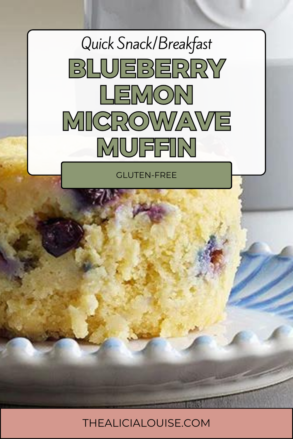 BLUEBERRY LEMON MICROWAVE MUFFIN text over a picture on a white and blue plate on a table top with a pampered chef ceramic egg cooker in the backgound