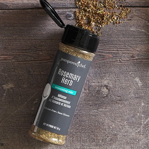 A jar of Pampered Chef Gluten-Free Rosemary Herb Seasoning, showcasing a blend of herbs and spices perfect for enhancing the flavor of various dishes.