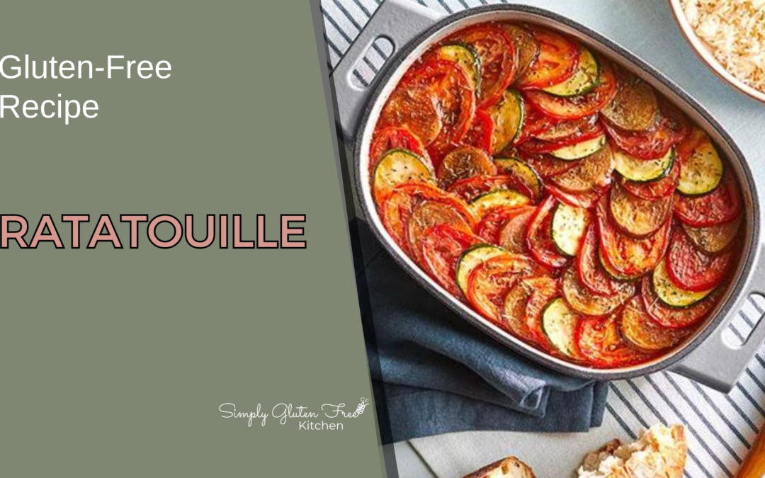 A beautifully arranged Gluten-Free Ratatouille in a cast iron dish, showcasing layers of vibrant red tomatoes, green zucchini, and purple eggplant, brushed with olive oil and balsamic vinegar, baked to perfection.